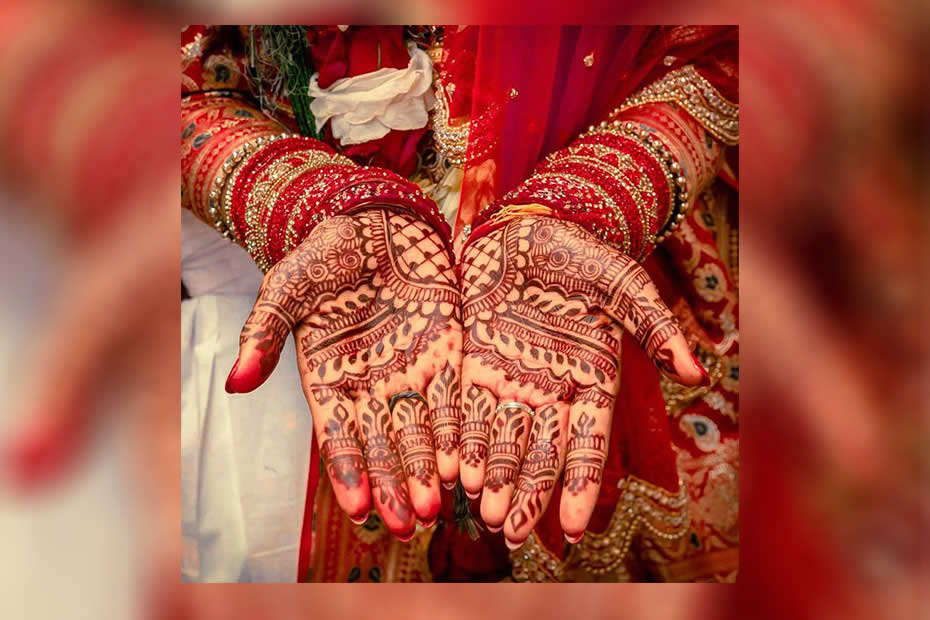 hands with mehndi tattoos