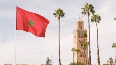 Koutoubia Mosque in Marrakech and the Moroccan flag