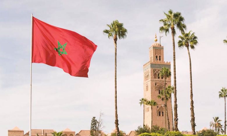 Koutoubia Mosque in Marrakech and the Moroccan flag