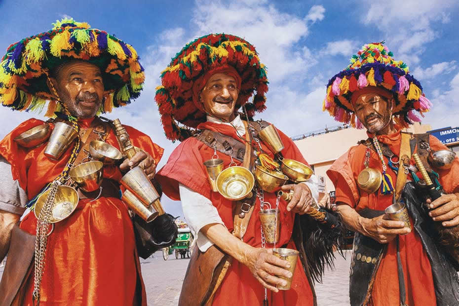 Things you should know about Marrakech: three water sellers in Morocco.