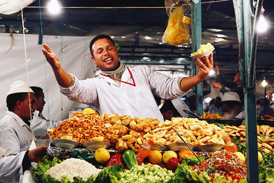 A Moroccan man selling food and street food in Marrakech 