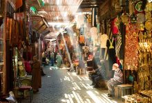 An alley full of shops selling traditional items in the souk of Marrakech at Jemaa el-Fna square