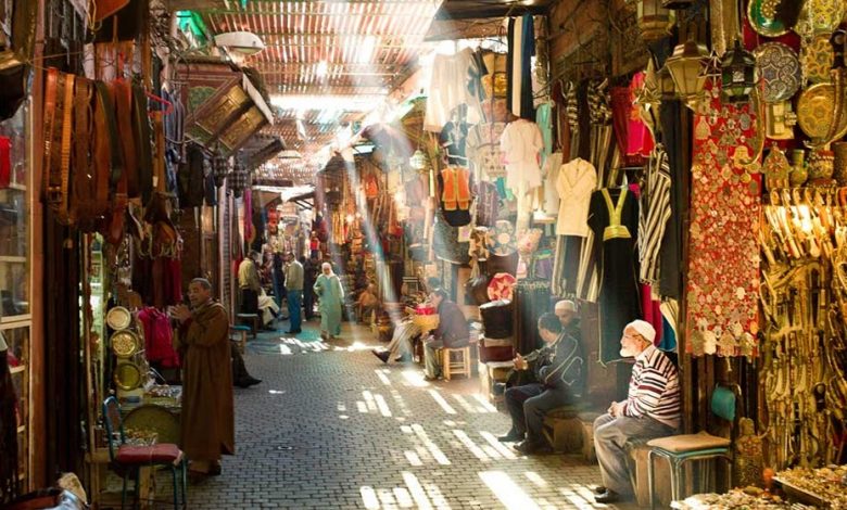 An alley full of shops selling traditional items in the souk of Marrakech at Jemaa el-Fna square