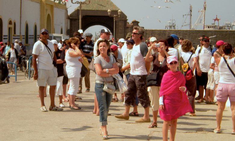 Many tourists admiring the surroundings of a Moroccan city