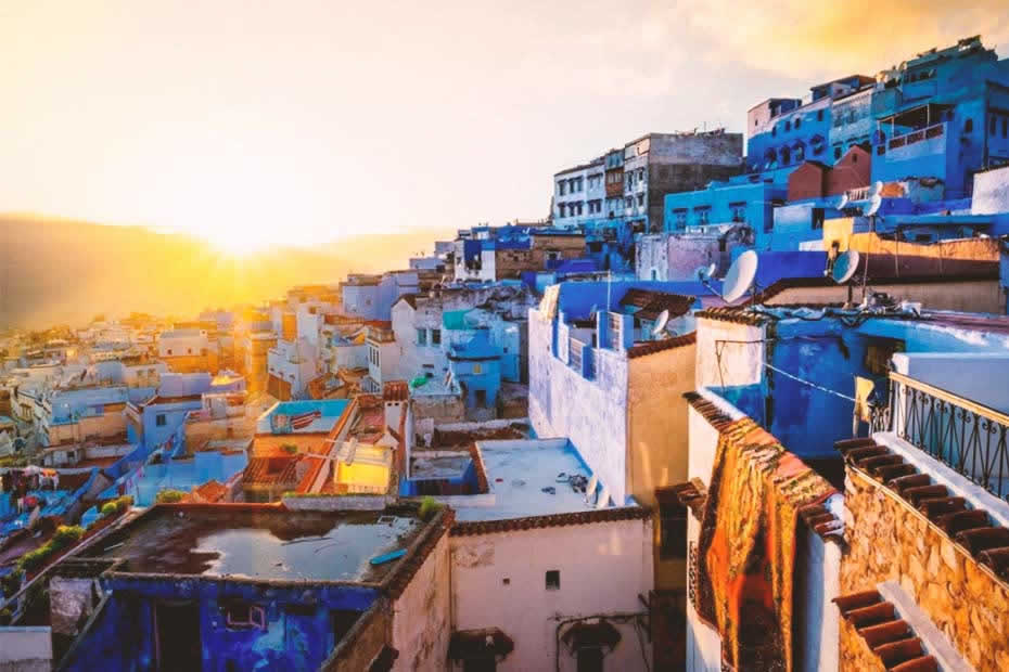 Fascinating view at sunset of Chefchaouen blue houses located in the hills of the rif