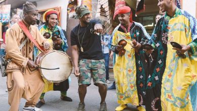 Usher dancing in Morocco with a gnawa group