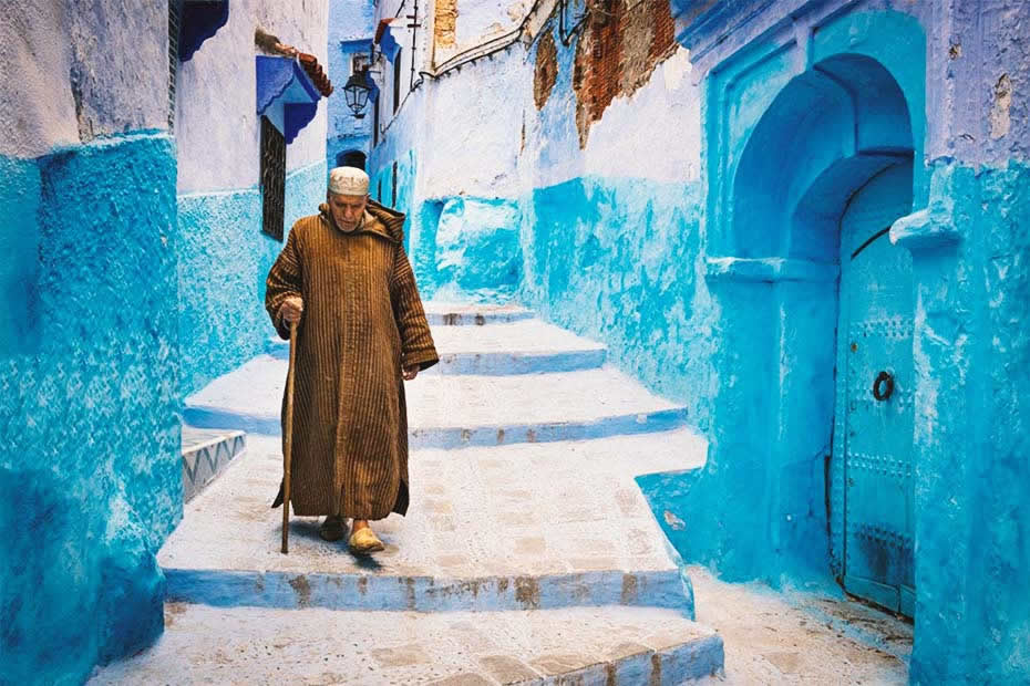 A Moroccan man wearing a jellaba in Chefchaouen, Morocco