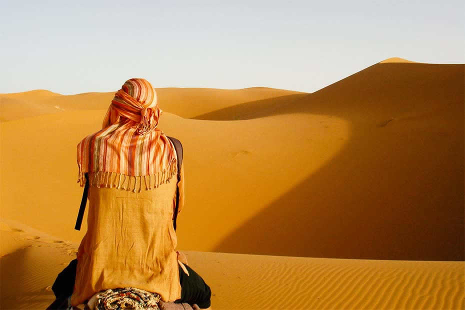 Someone in the Sahara desert of Morocco