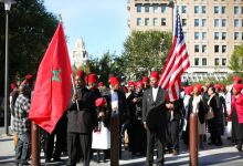 Most African-Americans are actually Moroccans Moors Moorish : Black man holding Moroccan US flag