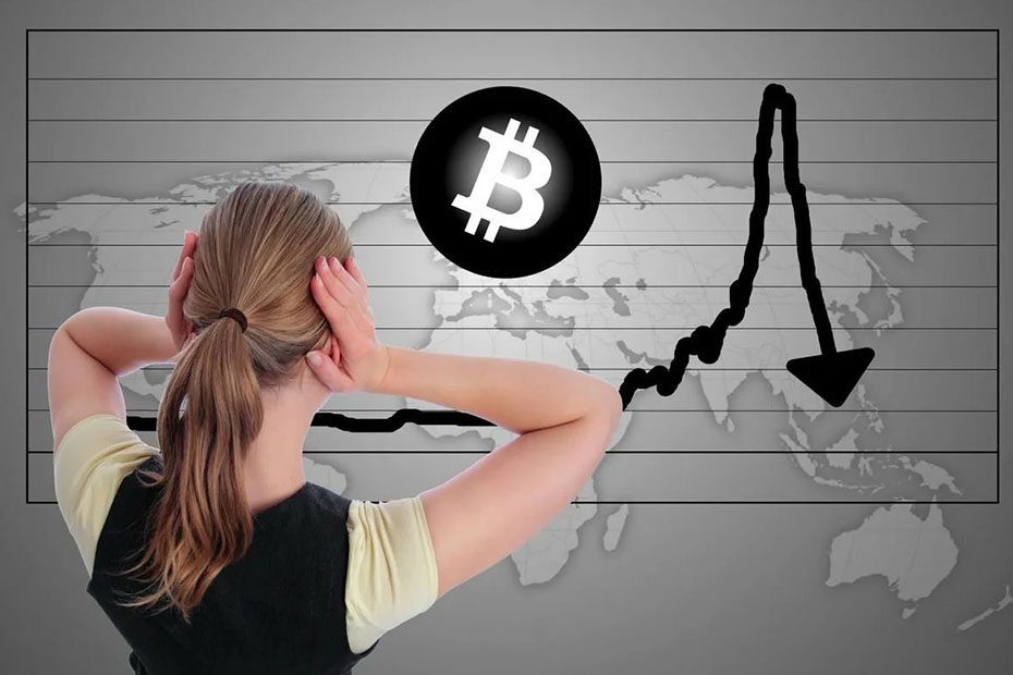 woman holding her head when seeing cryptocurrency dropping